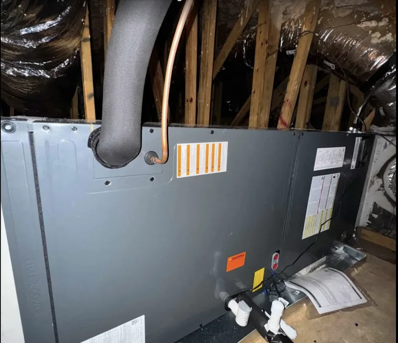 Smart Home Air & Heat technician repairing a furnace heating system in UCF Area FL
